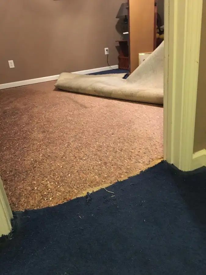 Carpet pad removal revealing water damage during Drying & Dehumidification in Lewistown